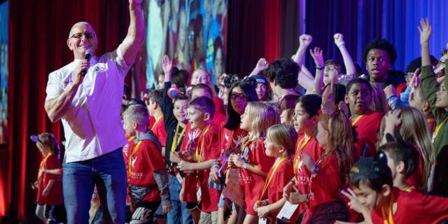 Chef Robert Irvine welcomes children of fallen military members to Snowball Express at Walt Disney World.