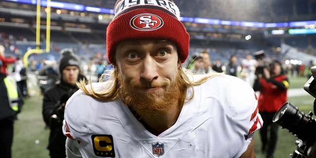 George Kittle #85 of the San Francisco 49ers runs off the field after defeating the Seattle Seahawks at Lumen Field on December 15, 2022 in Seattle, Washington.