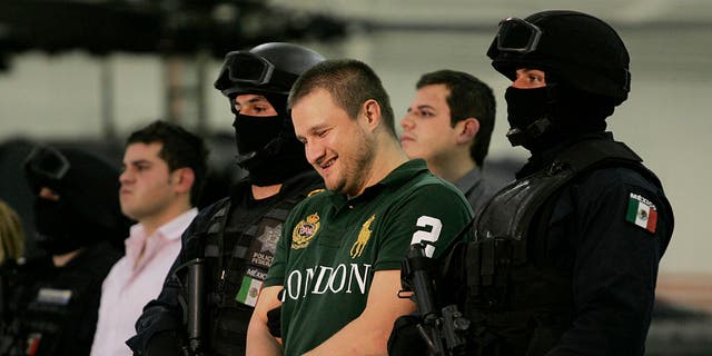 Edgar Valdez-Villarreal is shown to the press during a news conference at the federal police center in Mexico City on Aug. 31, 2010. (Daniel Aguilar/Getty Images)