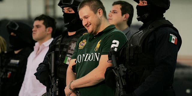 Edgar Valdez-Villarreal is shown to the press during a news conference at the federal police center in Mexico City on Aug. 31, 2010. (Daniel Aguilar/Getty Images)