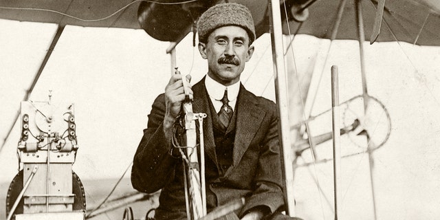 Orville Wright smiles for the camera while piloting powered Wright flyer III in Dayton, Ohio, in 1905.