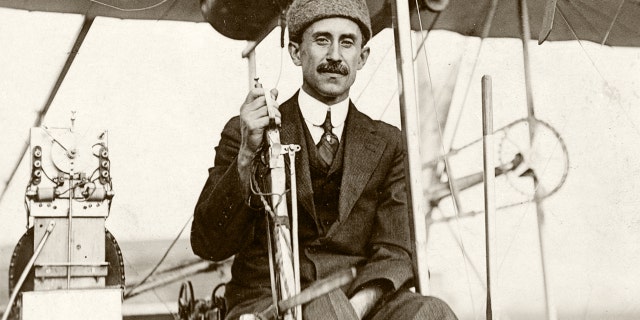 Orville Wright smiles for the camera while piloting powered Wright flyer III in Dayton, Ohio, in 1905.