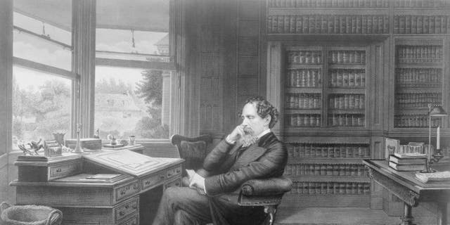 British novelist Charles Dickens (1812-1870) sat in his study in Gads Hill near Rochester, Kent, circa 1860. 
