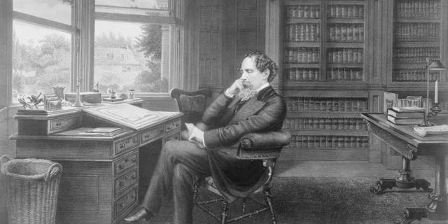 British novelist Charles Dickens (1812-1870) sat in his study in Gads Hill near Rochester, Kent, circa 1860. 