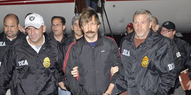 Former Soviet military officer and arms trafficker Viktor Bout (C) deplanes after arriving at Westchester County Airport November 16, 2010, in White Plains, New York. He was freed from a U.S. prison last week in exchange for WNBA star Brittney Griner, who was being held in Russia on drug charges. 