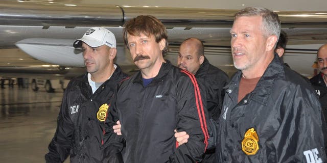 WHITE PLAINS, NEW YORK - NOVEMBER 16: In this photo furnished by the U.S. Department of Justice, former Soviet military officer and suspected arms trafficker Viktor Bout (C) is seen on November 16, 2010 in White Plains, New York. After arriving at Westchester County Airport, deplane from the plane. The match was handed over from Thailand to the United States to face terrorism charges after final efforts by Russian diplomats to seek his release failed.  (Photo by U.S. Department of Justice via Getty Images)
