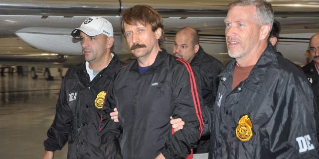 Former Soviet military officer and arms trafficking suspect Viktor Bout, center, takes off after arriving at Westchester County Airport in White Plains, New York, November 16, 2010.