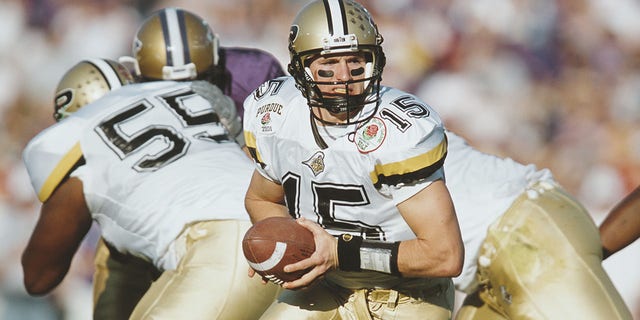 Drew Brees #15, Quarterback for the Purdue University Boilermakers calls the play at the snap against the University of Washington Huskies during the NCAA 87th Rose Bowl college football game on January 1, 2001, at the Rose Bowl Stadium, Pasadena, California, United States. The Washington Huskies won the game  34-24.  