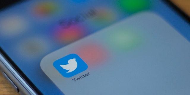 The Twitter logo is seen on a phone in this photo illustration in Washington, DC, on July 10, 2019.