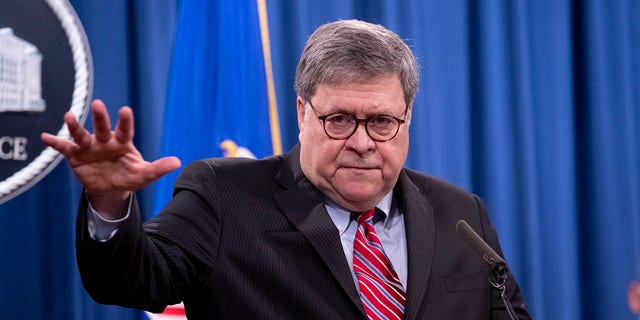 US Attorney General Bill Barr holds a news conference to provide an update on the investigation of the terrorist bombing of Pan Am flight 103 on the 32nd anniversary of the attack, at the Department of Justice December 21, 2020. 