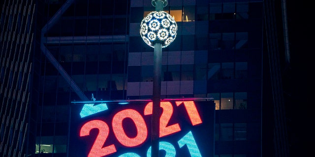 The Times Square Ball waits to drop to a mostly empty Times Square for New Year's Eve in New York City, Dec. 31, 2020, amid the coronavirus pandemic.