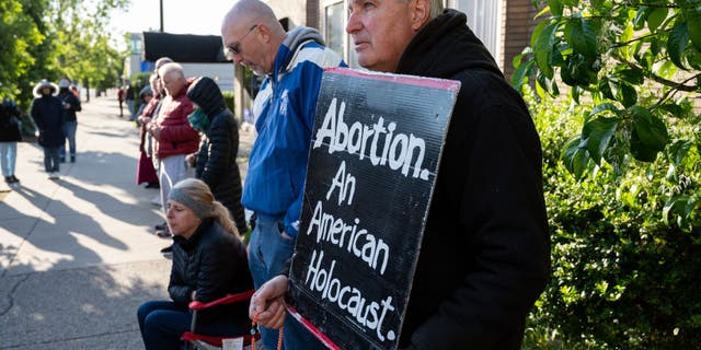 House Dems torched over 'ludicrously evil' vote against 'Born Alive Act' A pro-life demonstrator stands with his sign in front of EMW Women's Surgical Center, an abortion clinic, on May 8, 2021 in Louisville, Kentucky.