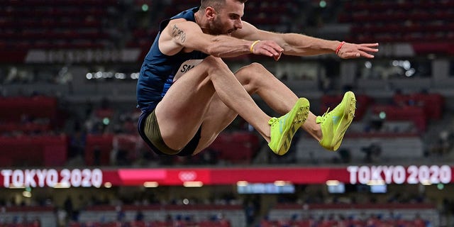 Albania's Izmir Smajlaj competes in the men's long jump qualification during the Tokyo 2020 Olympic Games at the Olympic Stadium in Tokyo on July 31, 2021.