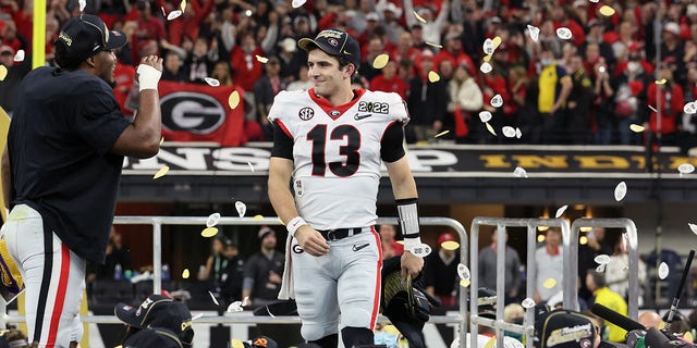 Georgia QB Stetson Bennett victorious after beating Alabama at Lucas Oil Stadium in Indianapolis.