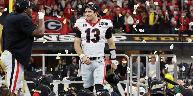 Georgia QB Stetson Bennett victorious after beating Alabama at Lucas Oil Stadium in Indianapolis.