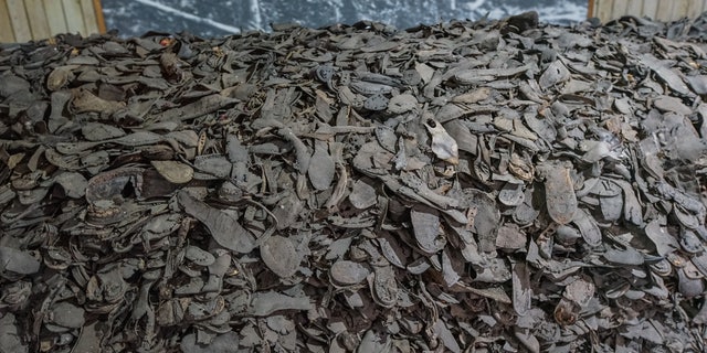 Heap of prisoners shoes in one of the barracks on the area of the former Nazi German concentration camp KL Stutthof is seen in Sztutowo, Poland on Sept. 10, 2022. Stutthof was the first Nazi concentration camp built outside of Germany. 