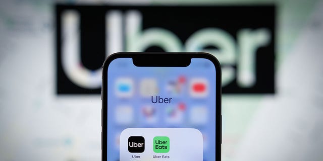 The Uber app application is seen on an Apple iPhone mobile phone. 