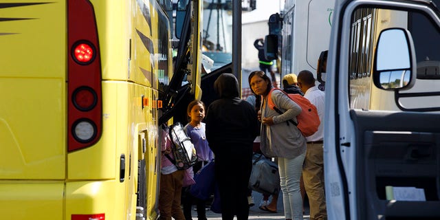 Venezuelan migrants are seen gathered at the Martha's Vineyard Haven ferry terminal in September before being transported to Joint Base Cape Cod. 