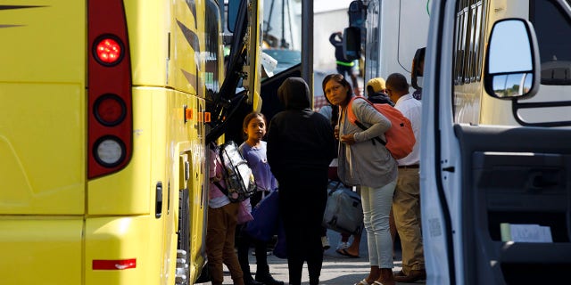 Venezuelan migrants are seen gathered at the Martha's Vineyard Haven ferry terminal in September before being transported to Joint Base Cape Cod. 