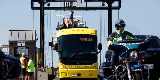 A bus with Venezuelan migrants arriving from Martha's Vineyard embarks to Joint Base Cape Cod in Buzzards Bay. 