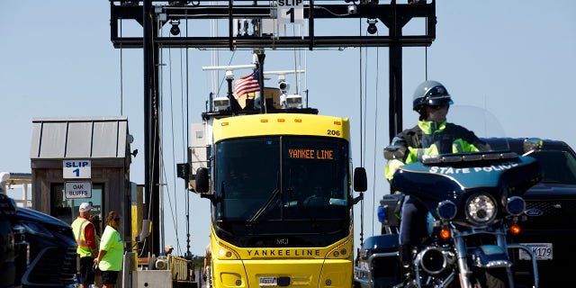 A bus with Venezuelan migrants arriving from Martha's Vineyard embarks to Joint Base Cape Cod in Buzzards Bay.