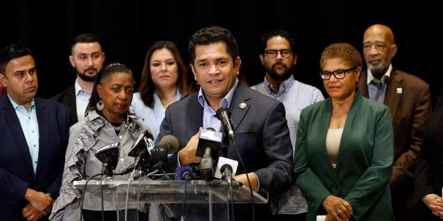Rep. Jimmy Gomez, D-Calif., center, and Los Angeles mayoral candidate Rep. Karen Bass, second from right, call on civic leaders from all over Los Angeles to initiate a plan of action to address the racist, anti-Black, antisemitic, anti-LGBTQ, anti-Indigenous, anti-Armenian recordings at a press conference on Oct. 21, 2022.