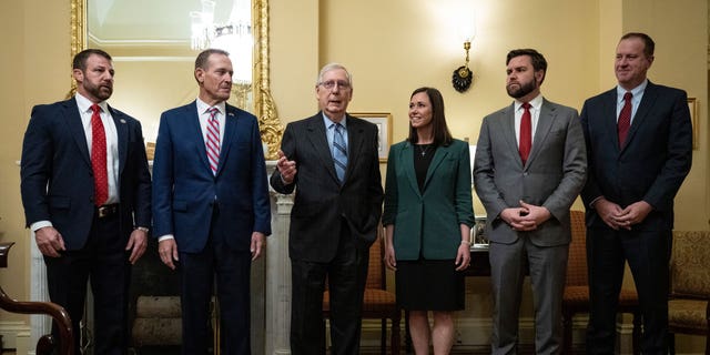 From left to right, Sen.-elect Markwayne Mullin (R-OK), Sen.-elect Ted Budd (R-NC), Senate Minority Leader Mitch McConnell (R-KY), Sen.-elect Katie Britt (R-AL ), Sen.-elect JD Vance (R-OH) and Sen.-elect Eric Schmitt (R-MO) stand for a photo opportunity in McConnell's office at the US Capitol on Nov. 15, 2022 in Washington, DC