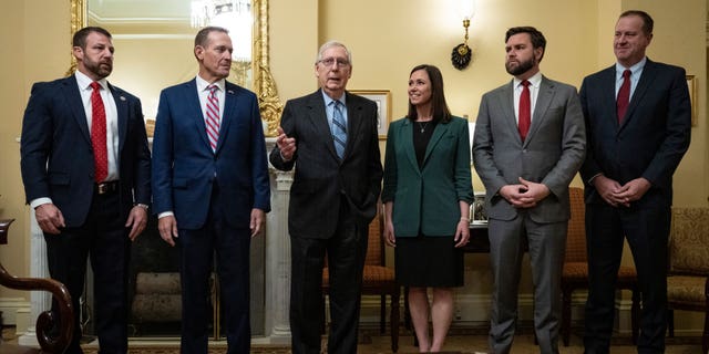 From left to right, Sen.-elect Markwayne Mullin (R-OK), Sen.-elect Ted Budd (R-NC), Senate Minority Leader Mitch McConnell (R-KY), Sen.-elect Katie Britt (R-AL ), Sen.-elect JD Vance (R-OH) and Sen.-elect Eric Schmitt (R-MO) stand for a photo opportunity in McConnell's office at the US Capitol on Nov. 15, 2022 in Washington, DC