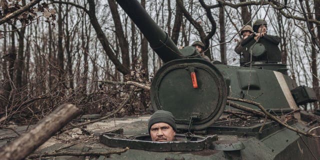 Ukrainian tank crews are seen on Nov. 27, 2022 at the Bakhmut forward base in Ukraine.