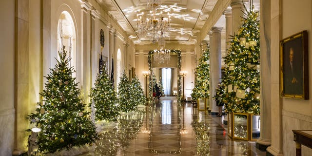 Christmas decorations are seen in the entrance and cross hall of the White House as part of first lady Jill Biden's "We the People" decorative theme in Washington, D.C., on Nov. 28, 2022. 