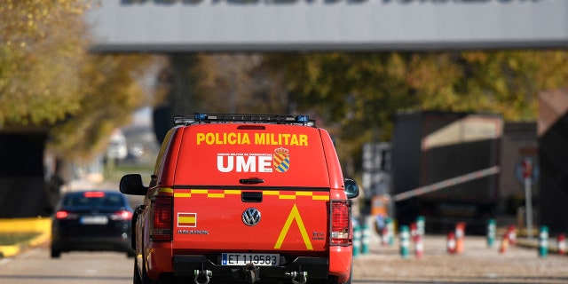 A military police car patrols at the main entrance of the Spanish air force base, in Torrejon de Ardoz near Madrid, on December 1, 2022, after Spain's security forces found a "suspect" package, a day after a letter bomb exploded at Ukraine's embassy in the Spanish capital. 