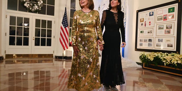 US Speaker of the House Nancy Pelosi and her daughter Alexandra Pelosi arrive at the White House to attend a state dinner honoring French President Emmanuel Macron, in Washington, DC, on December 1, 2022.