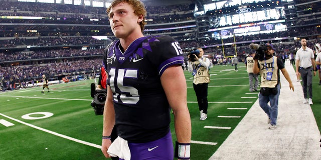 Max Duggan of the TCU Horned Frogs walks off the field following the teams 31-28 overtime loss to the Kansas State Wildcats in the Big 12 Football Championship on December 3, 2022 in Arlington, Texas.
