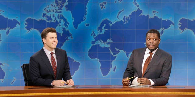 Anchor Colin Jost and anchor Michael Che during SNL's Weekend Update.