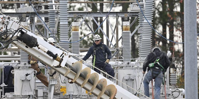 A view of the substation while work is in progress as tens of thousands are without power in Moore County, North Carolina.