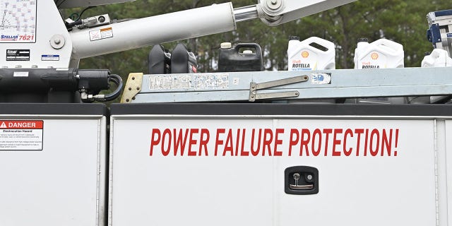 A view of the substation while work is in progress as tens of thousands are without power on Moore County, North Carolina, after an attack at two substations.