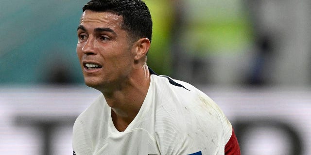 Portugal's forward #7 Cristiano Ronaldo reacts after his team lost the Qatar 2022 World Cup quarter-final football match between Morocco and Portugal at the Al-Thumama Stadium in Doha on December 10, 2022.