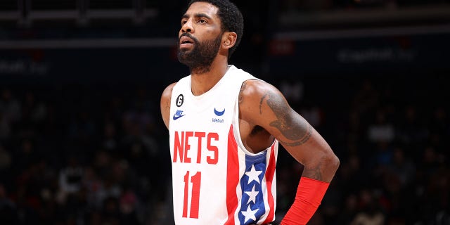 Kyrie Irving, #11 of the Brooklyn Nets, looks on during the game against the Washington Wizards on Dec. 12, 2022 at Capital One Arena in Washington, D.C.