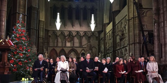 Front row from left to right, King Charles III, Camilla, Queen Consort, Prince William, Prince of Wales, Prince George, Princess Charlotte, Catherine, Princess of Wales and Sophie, Countess of Wessex during the "Together at Christmas" Carol Service.