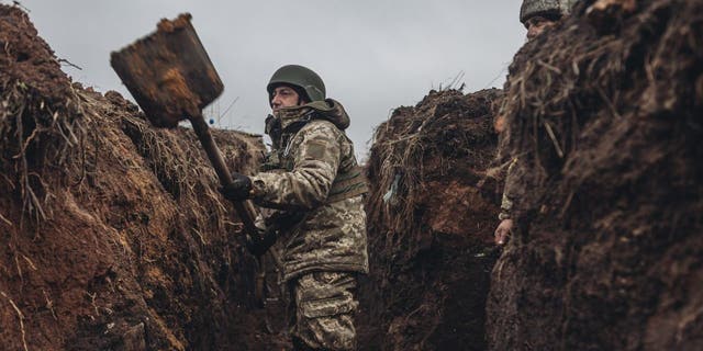 Ukrainian soldiers are seen in a trench in Bakhmut, Ukraine on Dec. 16, 2022.