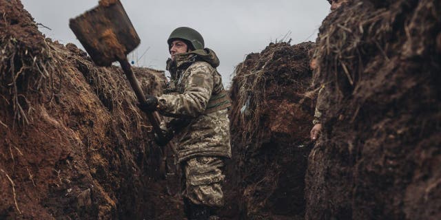 Ukrainian soldiers are seen in a trench in Bakhmut, Ukraine on Dec. 16, 2022.