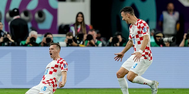 Mislav Orsic of Croatia celebrates after scoring his team's second goal with Ivan Perisic of Croatia during the FIFA World Cup Qatar 2022 3rd Place match between Croatia and Morocco at Khalifa International Stadium on December 17, 2022 in Doha, Qatar. 