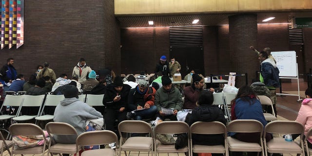 Migrants arriving from Del Rio, Texas, are pictured at Port Authority in Manhattan on Monday, Dec. 19, 2022. 