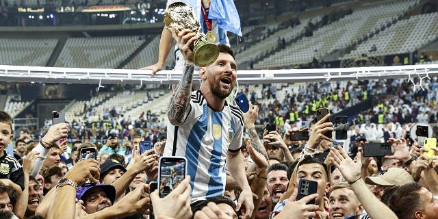 Lionel Messi celebrates winning the World Cup