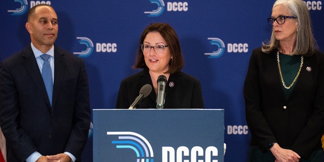 Rep. Suzan DelBene, flanked by incoming House Democratic leader Rep. Hakeem Jeffries and incoming House Democratic Whip Rep. Katherine Clark, speaks during the news conference at the DCCC on Wednesday.