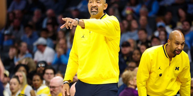 Michigan Wolverines head Coach Juwan Howard shouts instructions to his players during the Jumpman Invitational against the North Carolina Tar Heels at Spectrum Center in Charlotte, North Carolina, on Wednesday.
