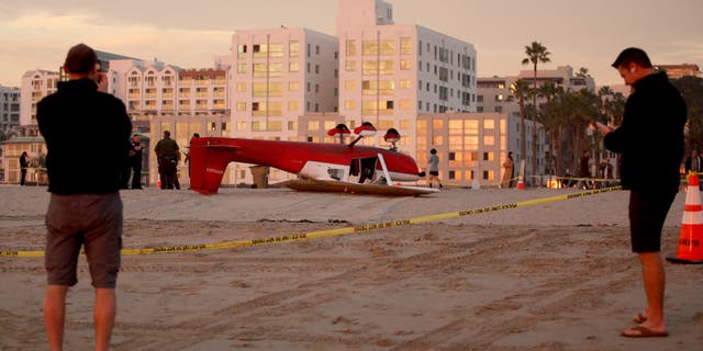 An investigation is underway into the crash of a single-engine Cessna plane after the pilot landed on the beach south of the pier, Thursday, Dec. 22, 2022, in Santa Monica, California. Firefighters were called to the 1800 block of Santa Monica Beach at 3:17 p.m., said Capt. Patrick Nulty, a spokesman for the city's fire department. Both occupants were rescued and taken to hospital.