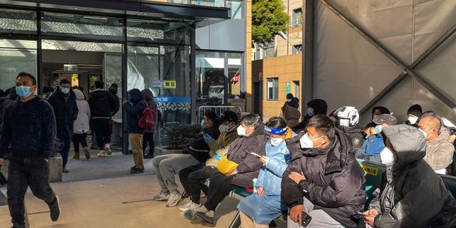 China to take away COVID-19 quarantine laws for inbound vacationers 1 People wait for medical attention at Fever Clinic area in Tongren Hospital in the Changning district in Shanghai, on December 23, 2022 - China is battling a wave of coronavirus infections that has hit the elderly hard but resulted in only a handful of reported deaths after the government redefined the criteria by which Covid-19 fatalities are counted.