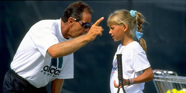 Undated: Tennis Coach Nick Bollettieri gives instructions to a young Anna Kournikova of Russia during a training session at his Tennis Academy in Bradenton, Florida, USA.  