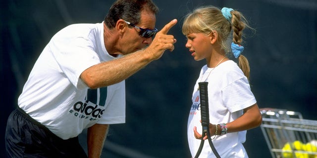 Undated: Tennis Coach Nick Bollettieri gives instructions to a young Anna Kournikova of Russia during a training session at his Tennis Academy in Bradenton, Florida, USA.  